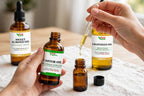Custom DIY hair growth and cuticle serum recipes blended in reusable amber glass bottle oil mixing